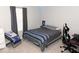 Comfortable bedroom featuring a bed, sleek desk, and chair, complete with ample natural light and modern decor at 9176 Springbrook Dr, Pendleton, IN 46064