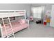 Bright bedroom featuring a charming bunk bed, decorative chair, and colorful storage for a retreat at 9176 Springbrook Dr, Pendleton, IN 46064