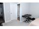 Bedroom with a carpet, doorway to the bathroom, a keyboard and chair, and a view into the bathroom at 9176 Springbrook Dr, Pendleton, IN 46064
