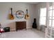Cozy bedroom with neutral tones, hardwood furniture, and a bright window with patterned curtains at 9176 Springbrook Dr, Pendleton, IN 46064