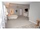 Large main bedroom with hard surface floors and neutral gray tones and a mounted TV at 9176 Springbrook Dr, Pendleton, IN 46064