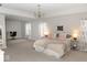Spacious primary bedroom with a decorative chandelier and lots of space for work and rest at 9176 Springbrook Dr, Pendleton, IN 46064