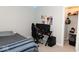 This bedroom features carpeted floors, a gaming setup, and an organized closet at 9176 Springbrook Dr, Pendleton, IN 46064