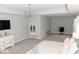 Bright main bedroom with gray walls, modern lighting, and a work desk at 9176 Springbrook Dr, Pendleton, IN 46064