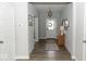 Bright entryway featuring wood floors, decorative accents, and a welcoming atmosphere at 9176 Springbrook Dr, Pendleton, IN 46064