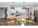 Bright kitchen features stainless steel appliances, pendant lighting, and an island with seating at 9176 Springbrook Dr, Pendleton, IN 46064