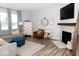 Stylish living room featuring a fireplace, comfortable seating, and modern decor at 9176 Springbrook Dr, Pendleton, IN 46064
