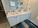 Bathroom featuring double sink vanity with drawers and cabinets at 9653 Woodsong Way, Indianapolis, IN 46229