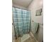 Cozy bathroom with blue striped shower curtain, towel rack and decor at 9653 Woodsong Way, Indianapolis, IN 46229