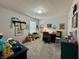 Well-lit room with neutral carpet, showcasing ample space for play and study, decorated with items at 9653 Woodsong Way, Indianapolis, IN 46229