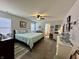 Spacious bedroom featuring a ceiling fan and ensuite bathroom at 9653 Woodsong Way, Indianapolis, IN 46229