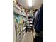 Organized walk-in closet with shelving, hanging racks and storage bins at 9653 Woodsong Way, Indianapolis, IN 46229