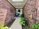 Welcoming entryway with brick walls, lovely decor, and ample natural light at 9653 Woodsong Way, Indianapolis, IN 46229