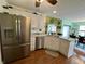 Well-equipped kitchen featuring stainless steel appliances, granite countertops, and island sink at 9653 Woodsong Way, Indianapolis, IN 46229