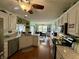 Open-concept kitchen with granite countertops, stainless steel appliances, and views into dining area at 9653 Woodsong Way, Indianapolis, IN 46229