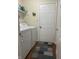 Efficient laundry area with white appliances and a convenient layout for household chores at 9653 Woodsong Way, Indianapolis, IN 46229
