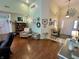 Inviting living room with high ceilings, unique decor, and hardwood floors at 9653 Woodsong Way, Indianapolis, IN 46229