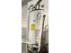 Richmond water heater with detailed labeling, including energy efficiency ratings and service contact information at 9653 Woodsong Way, Indianapolis, IN 46229