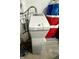 GE Water Softener with digital display, set on a platform with storage containers behind it at 9653 Woodsong Way, Indianapolis, IN 46229