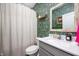Charming bathroom with stylish wallpaper, a modern vanity, and a bright, inviting feel at 9804 Canyon Ln, Pendleton, IN 46064