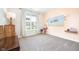 Well-lit bedroom with a large window and neutral colors, creating a relaxing space at 9804 Canyon Ln, Pendleton, IN 46064