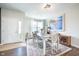 Bright dining room featuring stylish table setting, ample natural light, and chic decor, perfect for entertaining guests at 9804 Canyon Ln, Pendleton, IN 46064