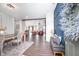 Open-concept entryway with wood floors, modern decor, and seamless flow into the dining and living spaces at 9804 Canyon Ln, Pendleton, IN 46064