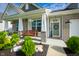 Charming front porch with a swing, manicured landscaping, and a welcoming entrance with wreath on the door at 9804 Canyon Ln, Pendleton, IN 46064