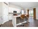 Contemporary kitchen island with breakfast bar, stainless steel appliances, and ample counter space, perfect for casual dining at 9804 Canyon Ln, Pendleton, IN 46064