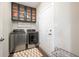 Convenient laundry room with modern appliances, plenty of storage, and a clean, organized layout at 9804 Canyon Ln, Pendleton, IN 46064