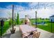Spacious patio with pizza oven and dining area is ideal for entertaining and enjoying outdoor meals at 9804 Canyon Ln, Pendleton, IN 46064