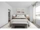 Relaxing main bedroom with neutral tones, soft lighting, and ensuite bathroom at 9891 Baneberry Ln, Carmel, IN 46290