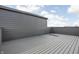Spacious rooftop deck with modern gray wood and ample room for outdoor entertaining at 9891 Baneberry Ln, Carmel, IN 46290