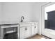 Stylish wet bar features modern fixtures, wine fridge, and quartz countertops at 9891 Baneberry Ln, Carmel, IN 46290