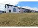 View of the back of several two-story homes with a spacious lawn and blue sky at 9928 Deep Royal Way, Indianapolis, IN 46239