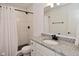 Well-lit bathroom featuring a shower with black fixtures and granite countertop vanity at 9928 Deep Royal Way, Indianapolis, IN 46239