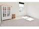 A minimalist bedroom with bright natural light, and a cozy chair to create inviting space at 9928 Deep Royal Way, Indianapolis, IN 46239