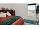 Bright bedroom featuring a window, displaying decor on headboard bookshelf for a personal touch at 9928 Deep Royal Way, Indianapolis, IN 46239