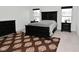 Bedroom with a dark wood bedroom set and a patterned rug at 9928 Deep Royal Way, Indianapolis, IN 46239