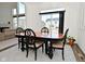 Dining room with a dark wood table, neutral rug and plenty of natural light from a sliding glass door at 9928 Deep Royal Way, Indianapolis, IN 46239