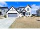 Charming two-story home with a gray garage, gray shutters and a manicured front yard at 9928 Deep Royal Way, Indianapolis, IN 46239