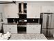 The modern kitchen features sleek stainless steel appliances, granite countertops, and stylish black backsplash at 9928 Deep Royal Way, Indianapolis, IN 46239