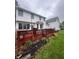 Spacious backyard with a red deck perfect for outdoor entertaining at 10118 Leeward Blvd, Indianapolis, IN 46256