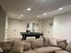 Finished basement area featuring a ping pong table and ample space for recreational activities at 10118 Leeward Blvd, Indianapolis, IN 46256
