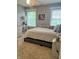 Comfortable bedroom featuring natural light and neutral decor, creating a serene atmosphere at 10118 Leeward Blvd, Indianapolis, IN 46256