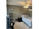 Relaxing bedroom offering a bed, a ceiling fan, and shelf decor perfect for unwinding after a long day at 10118 Leeward Blvd, Indianapolis, IN 46256