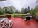 Inviting backyard deck perfect for grilling and relaxing with an expansive green lawn at 10118 Leeward Blvd, Indianapolis, IN 46256