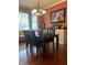 Formal dining room with rich hardwood floors and elegant lighting at 10118 Leeward Blvd, Indianapolis, IN 46256