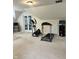Well-equipped home gym with an elliptical machine and treadmill at 10118 Leeward Blvd, Indianapolis, IN 46256