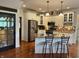 Updated kitchen featuring granite countertops, stainless steel appliances, and decorative tile backsplash at 10118 Leeward Blvd, Indianapolis, IN 46256